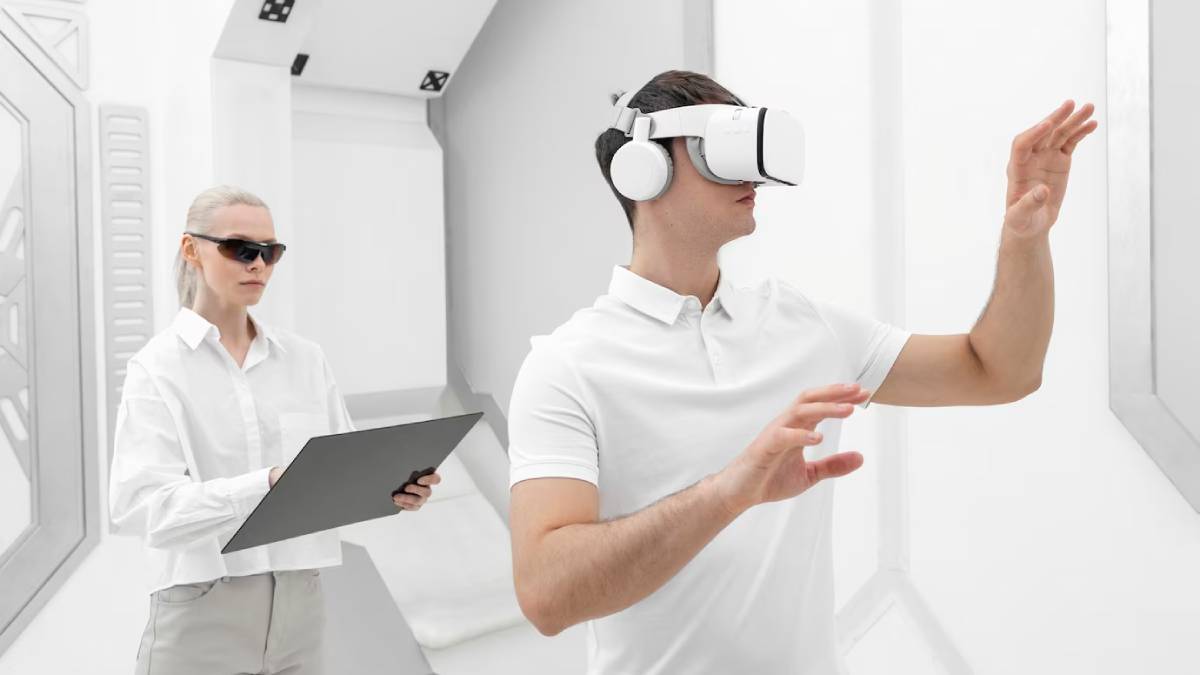 A man in VR headset gesturing, with a woman holding a clipboard in a futuristic white room.