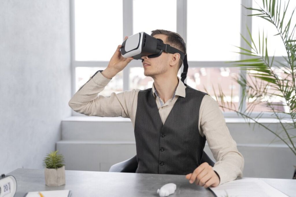Man wearing a virtual reality headset in a modern office setting.